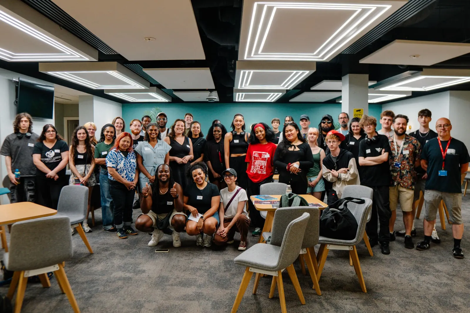 A group gathered for a City That Shape Us photograph.